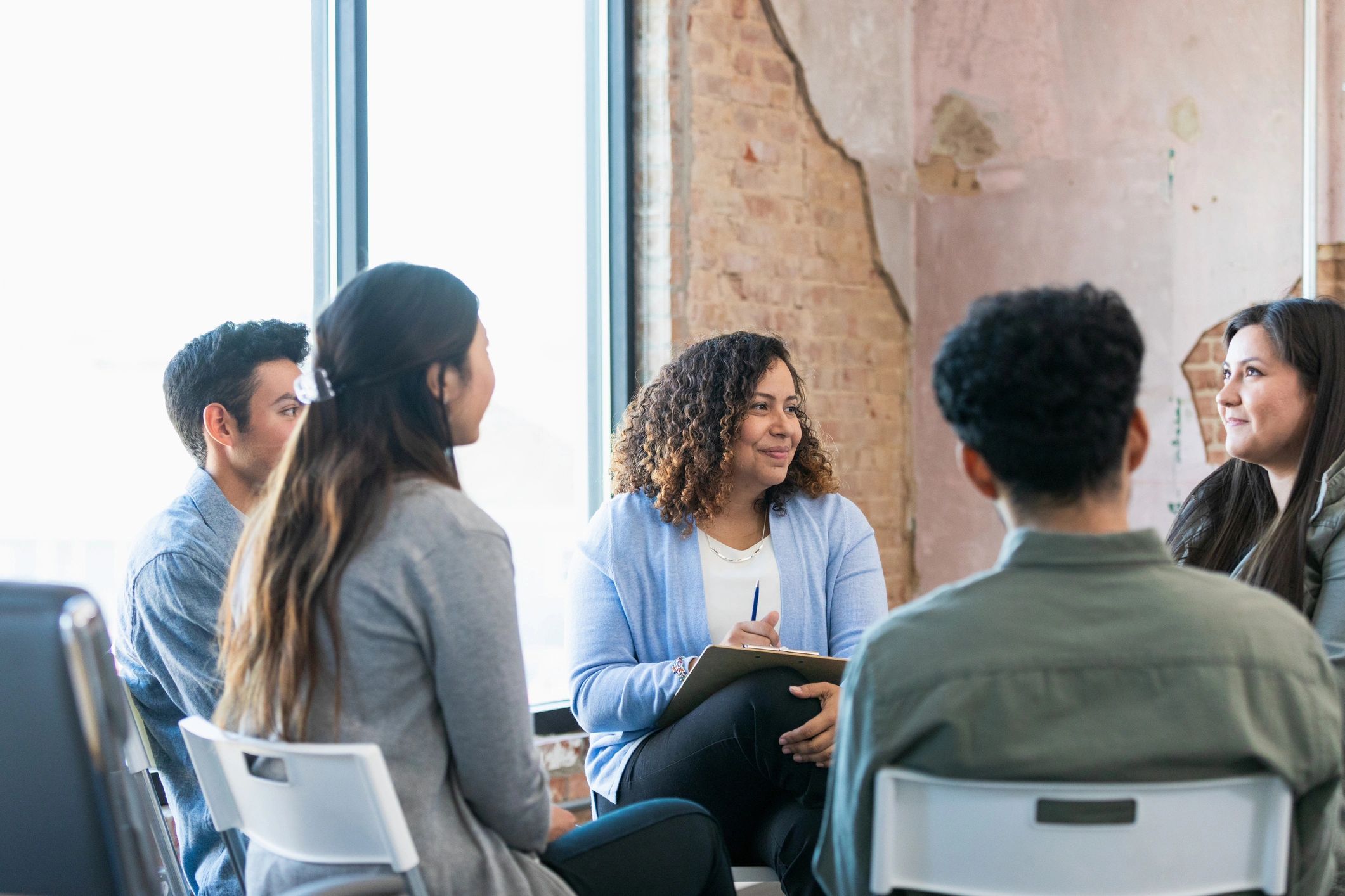 Group listening attentively during a facilitated support meeting