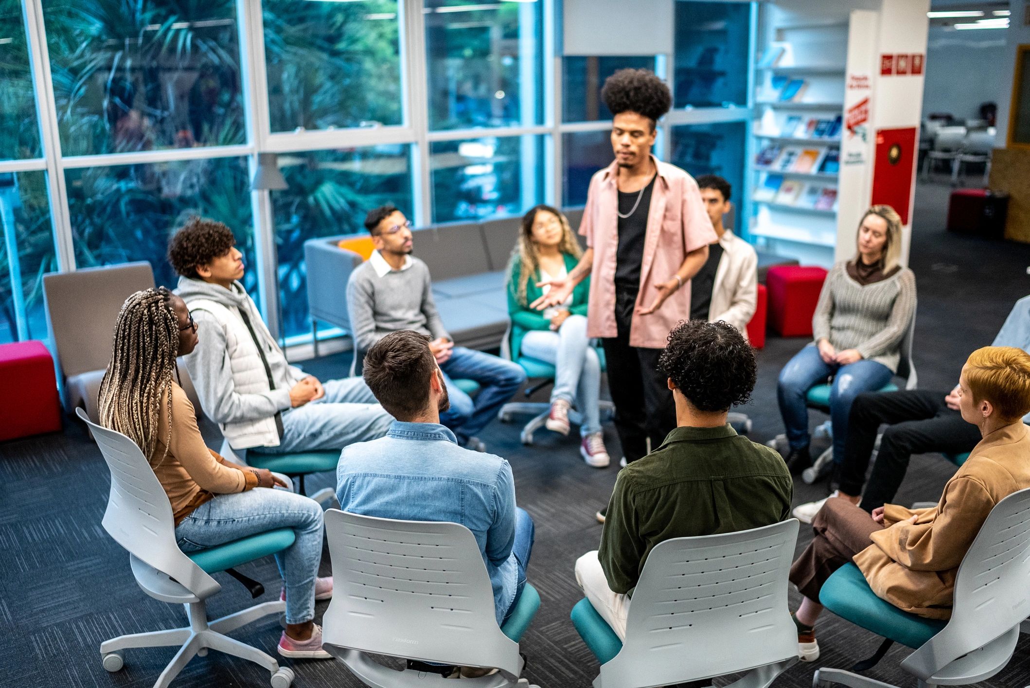Speaker addressing a small group in an educational setting