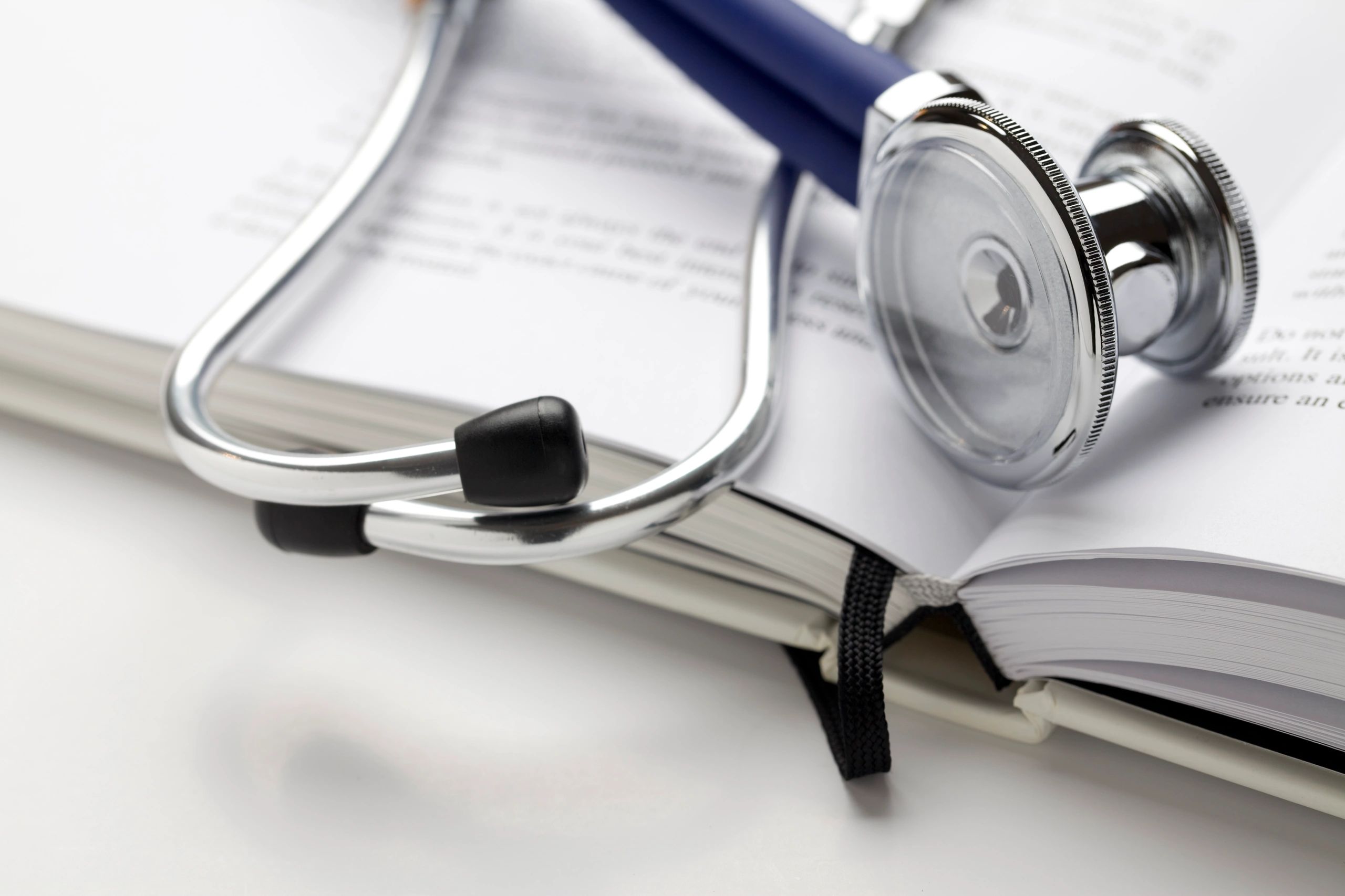 Stethoscope on a book, representing health information and learning