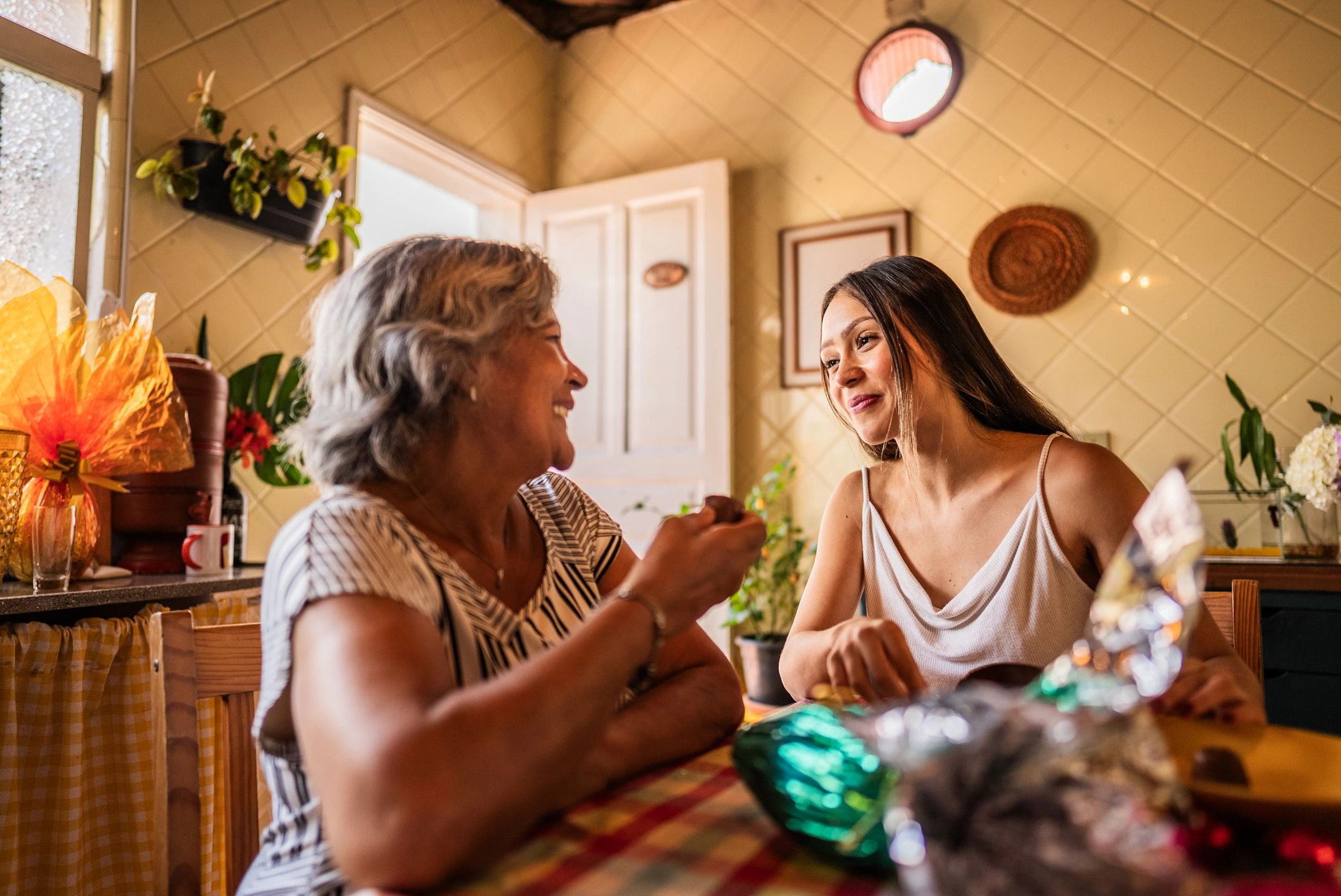 Two family members talking together at home