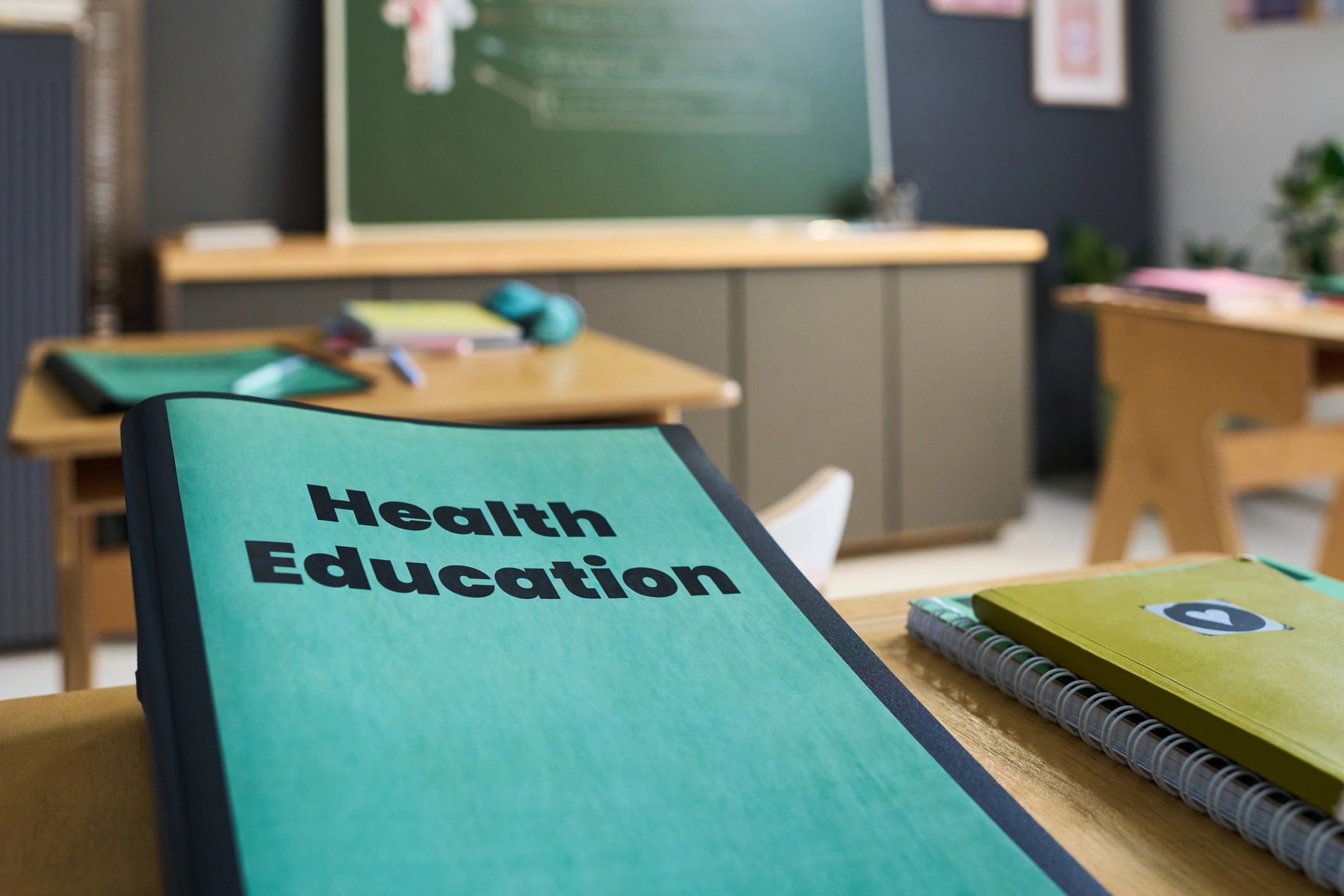 Health education workbook on a desk, representing printable learning materials